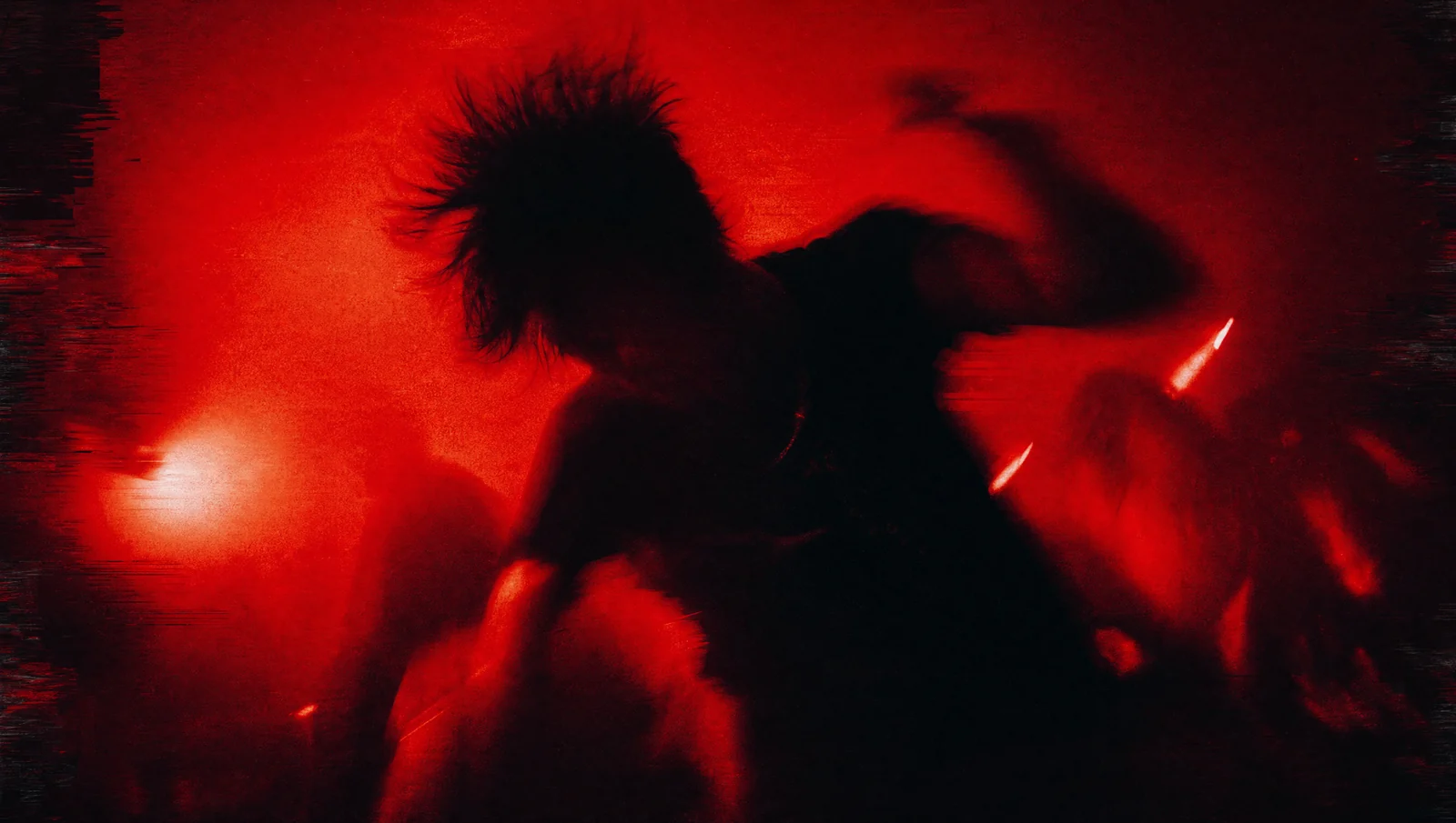 A performer dissolved into strobe and frame smear. Built for hard, fast tracks.