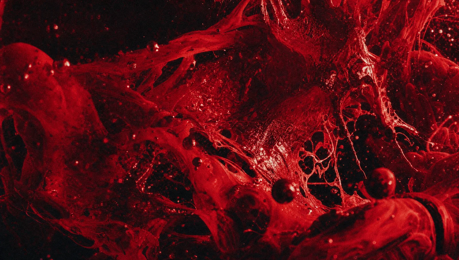 Ink and liquid torn through water in macro. Built for heavy, slow, hypnotic cuts.